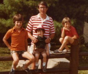 On the fence with Joe, Jon and Tom Banks, with father Joe Banks.